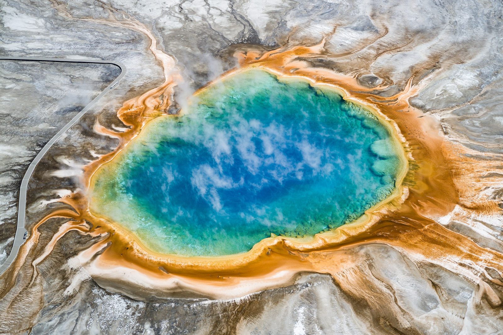 Grand Prismatic Spring seen from above, turquoise center ringed with orange